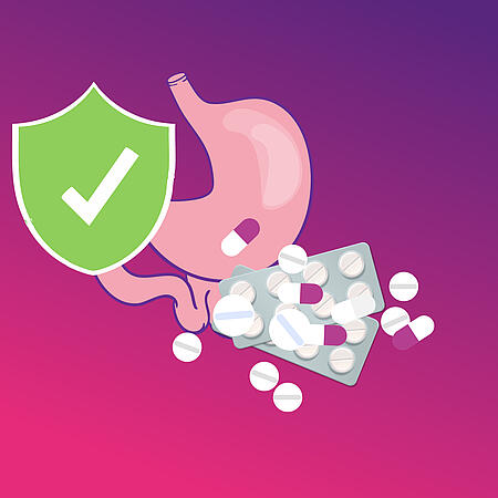 Abbildung eines Magens, mehreren Tabletten und eines grünen Schutzschilds